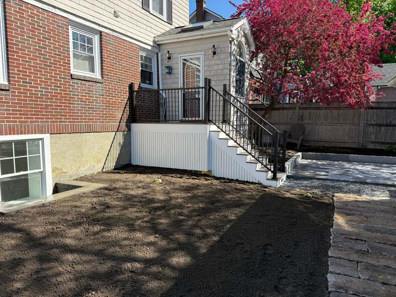 Completed deck and staircase viewed from the yard